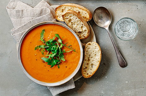 Image of "Carrot and tomato soup with toast dippers"