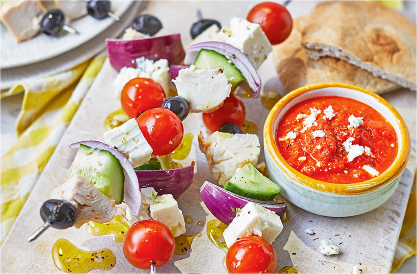 Greek salad kebabs with red pepper dip