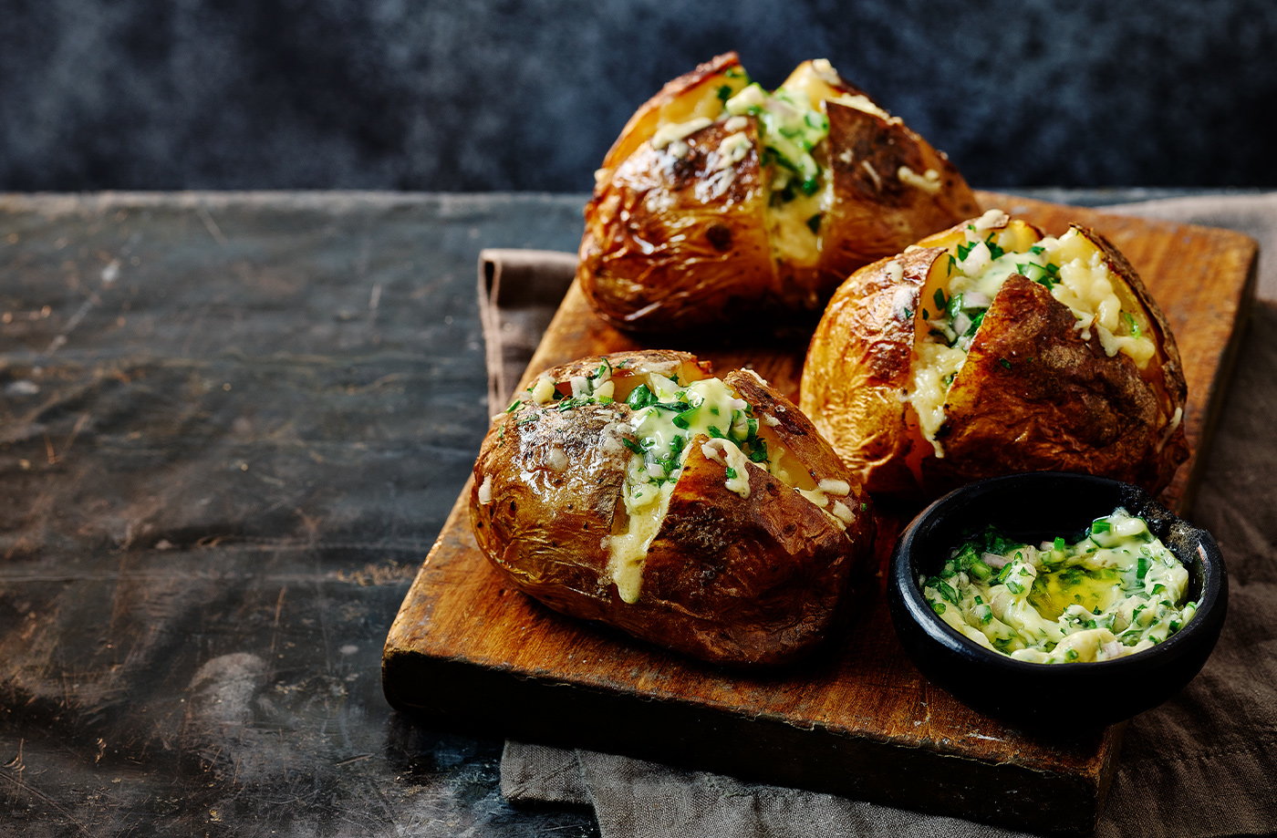 Herby baked potato with vintage Cheddar