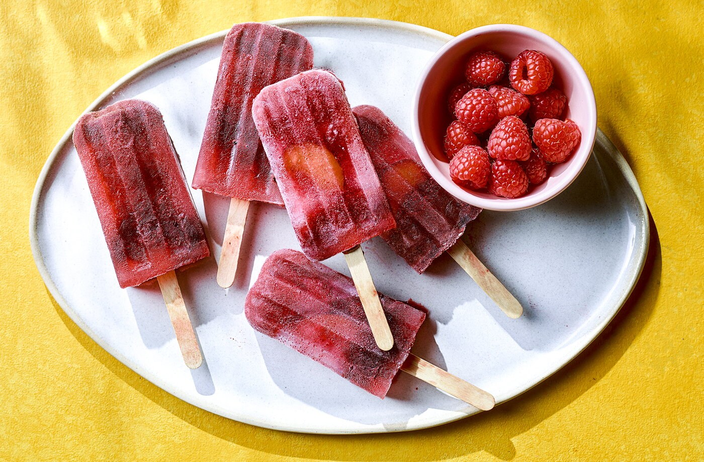 Roasted plum and raspberry lollies