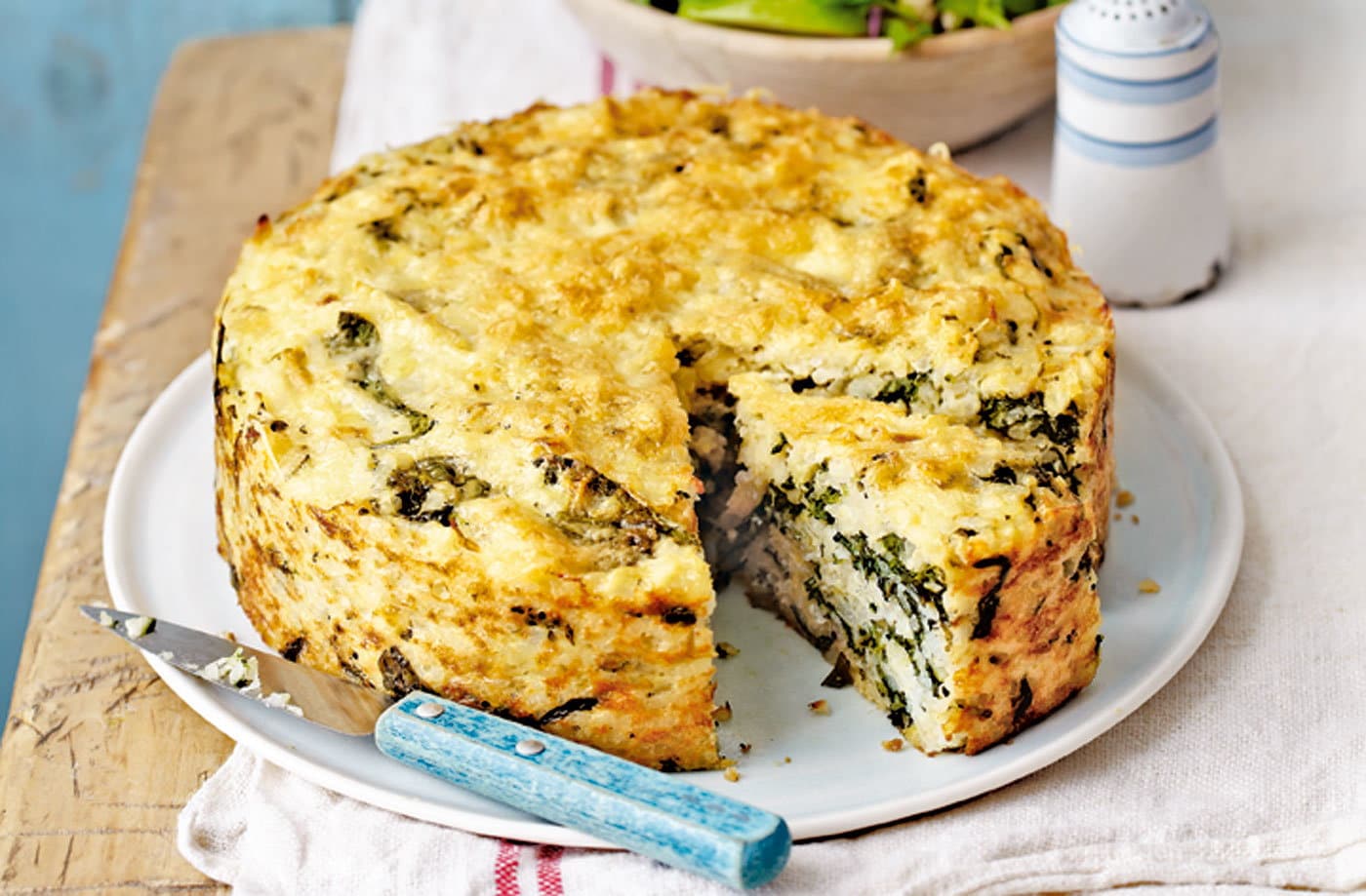 Spinach and Gruyère risotto cake with red cabbage winter salad