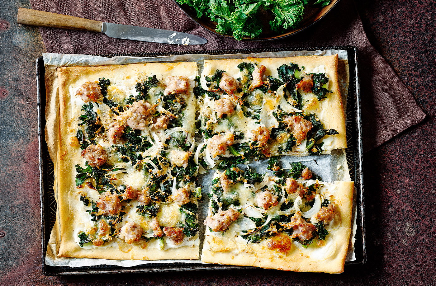 Sausage and kale pizzas