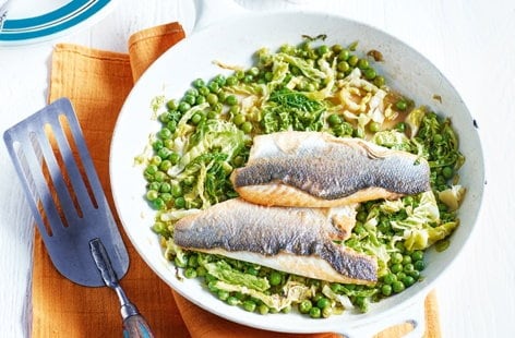 Image of "Buttery sea bass fillets with cider-braised greens"