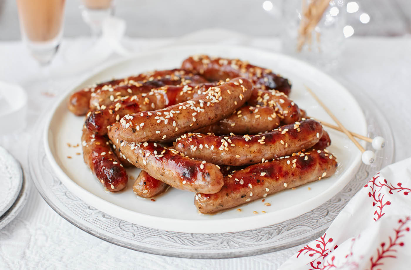Chipolatas with plum jam and sesame seeds