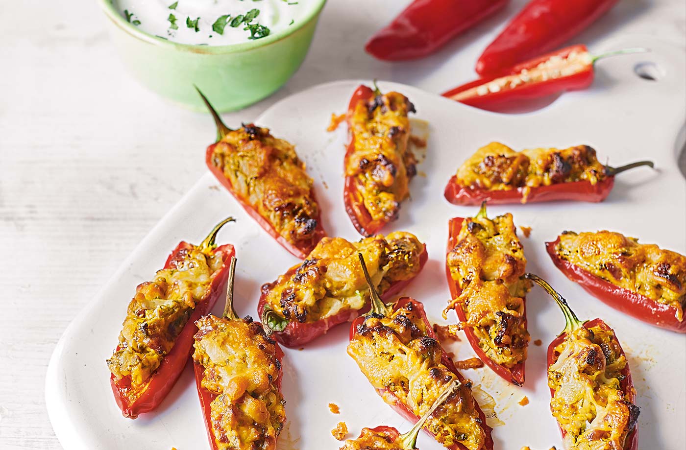 Chorizo-stuffed chillies with coriander dip