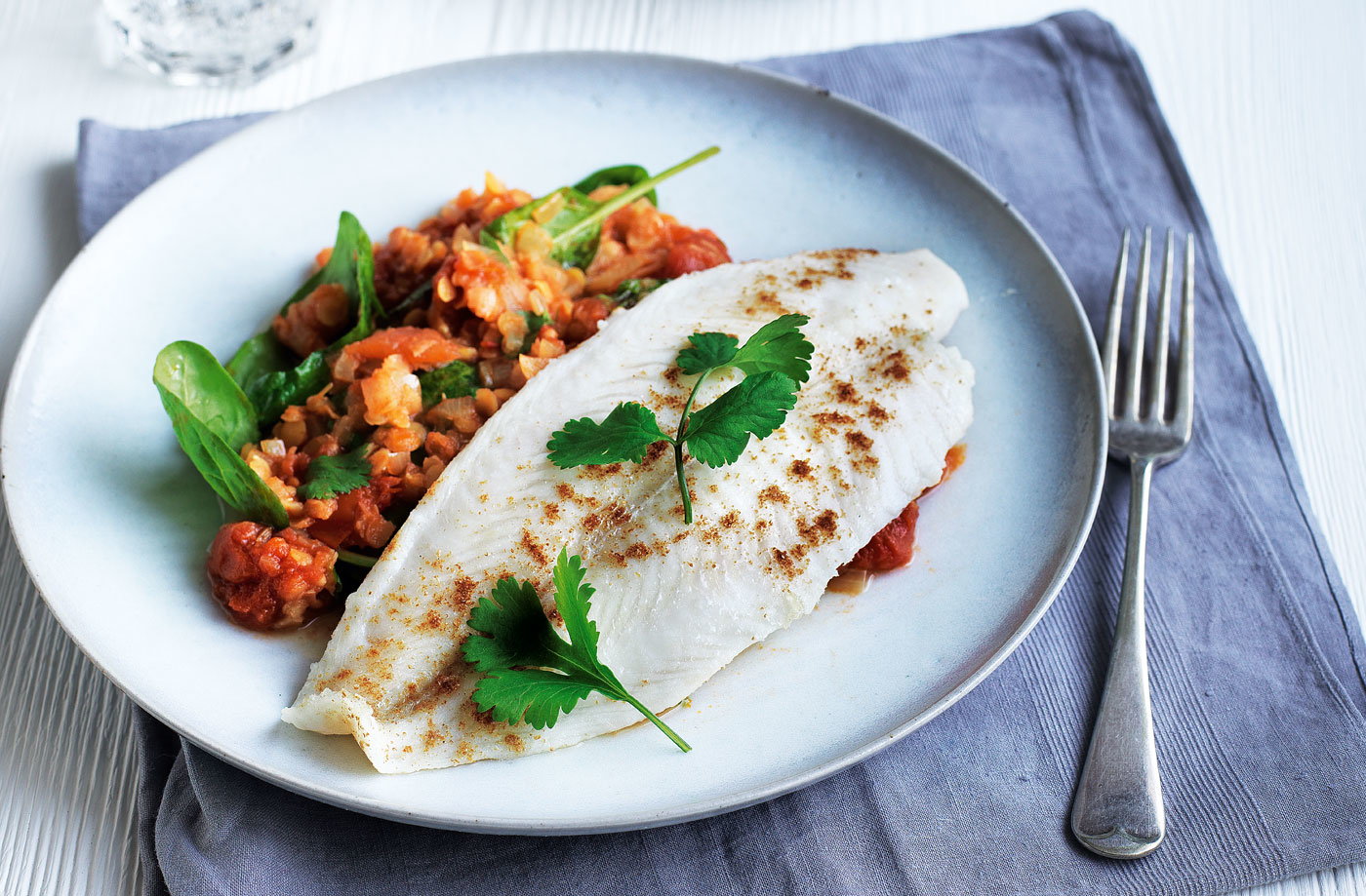 Pan-fried cobbler with red lentil and spinach dhal