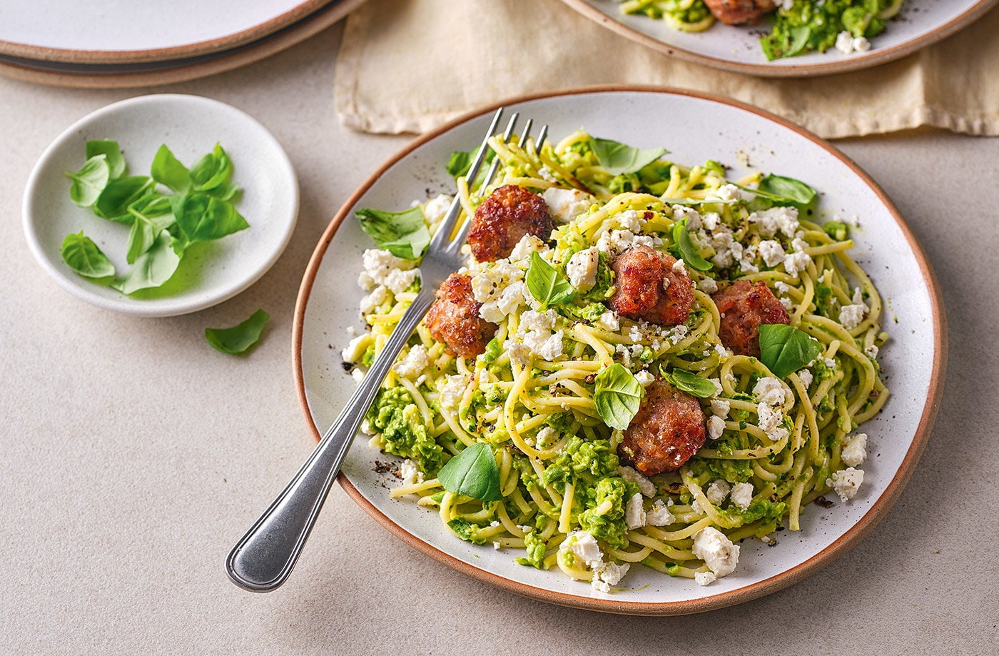 Sausage meatballs with pea pesto and spaghetti