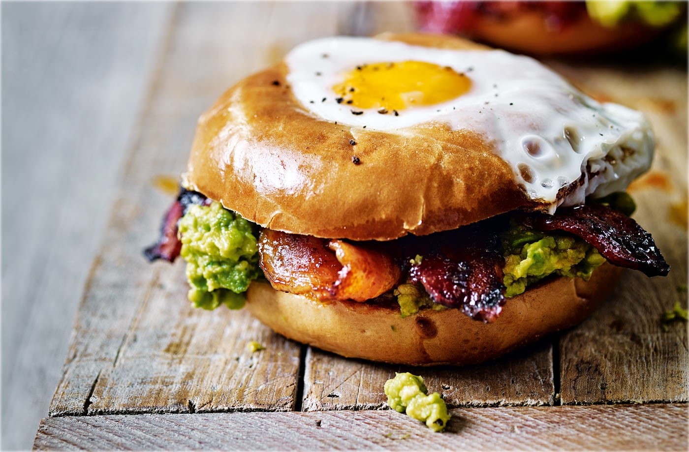Egg in a hole with spicy bacon and guacamole