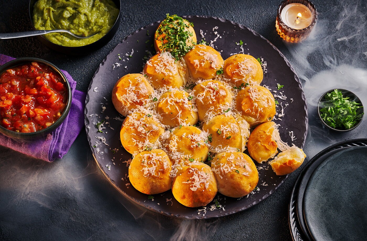 Pumpkin-shaped tear and share cheesy doughballs