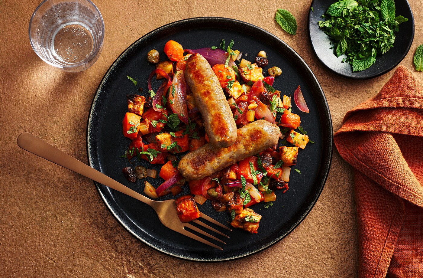 Sausages with Sicilian-inspired carrot stew