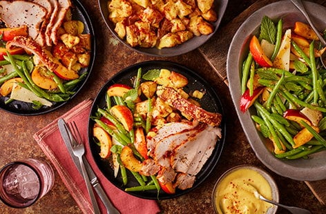 Image of "Paprika and garlic rubbed roast pork with roast potatoes, nectarine salad and saffron aioli"