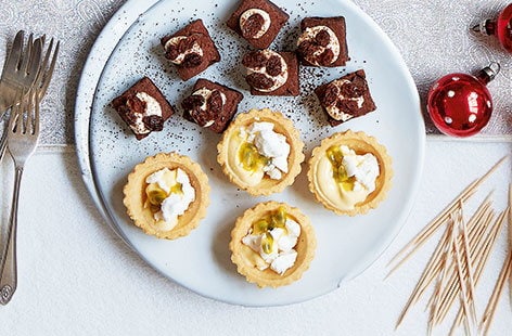 Image of "Tropical eton mess tartlets"