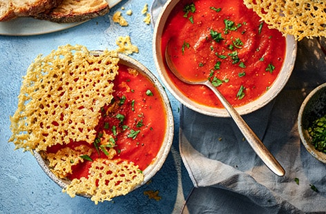 Image of "Tomato soup with cheesy topper"