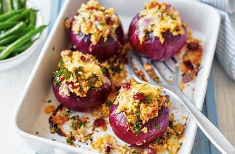 Image of "Red onions stuffed with bulgur wheat, celeriac and kale"