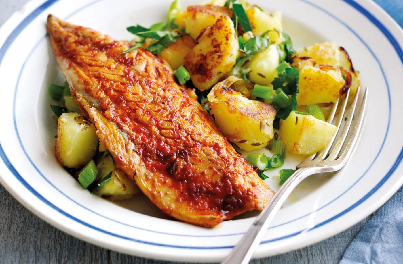 Harissa-spiced mackerel with cumin potato hash