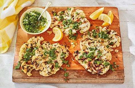 Image of "BBQ cauliflower steaks and herb sauce"