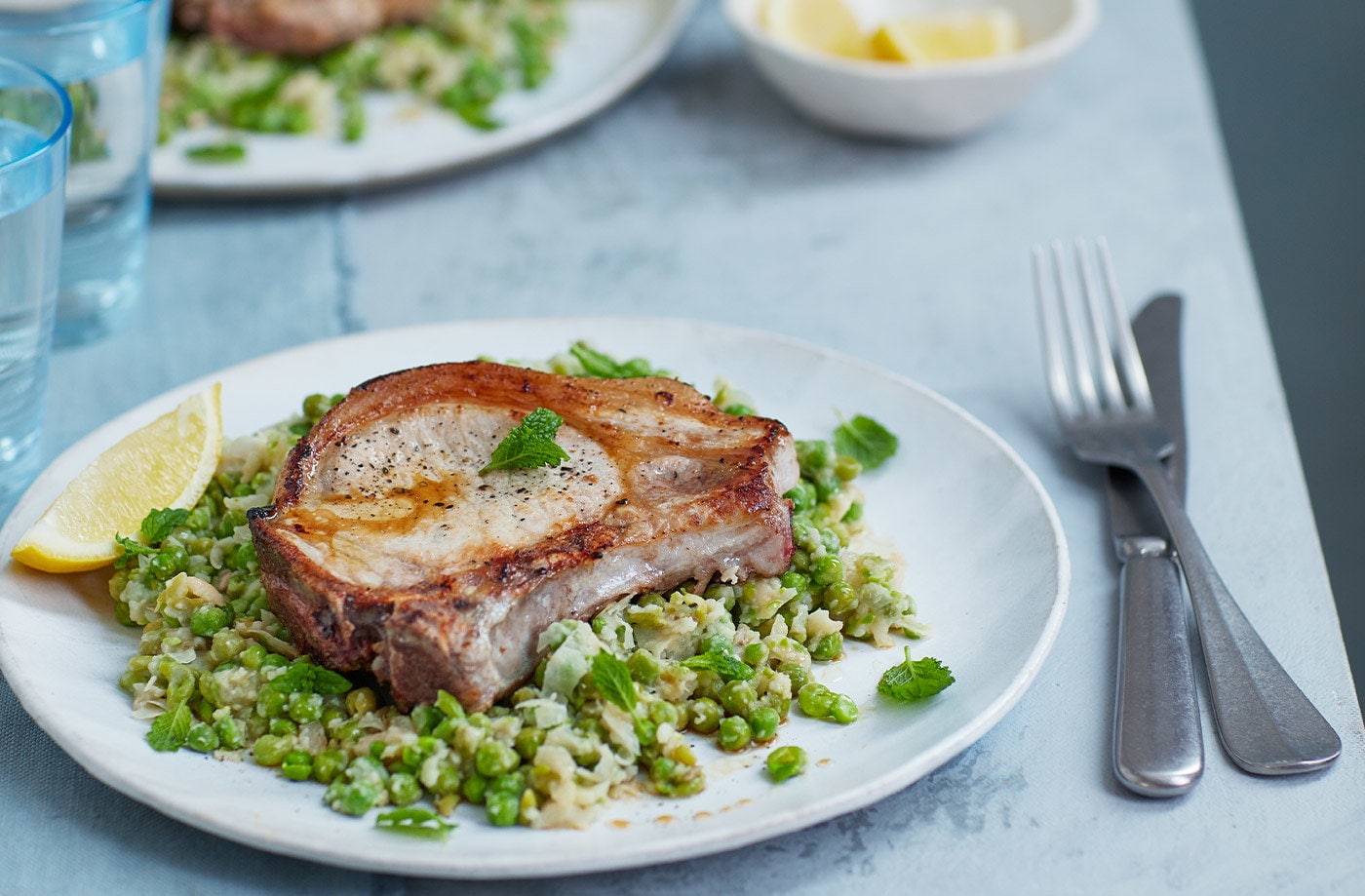 Pork chops with bean and pea mash