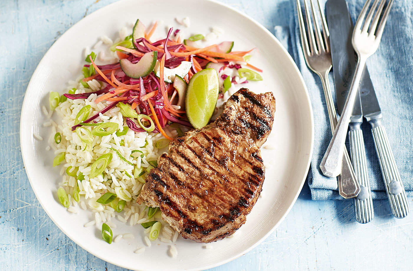 Jerk pork chops with lime rice and slaw