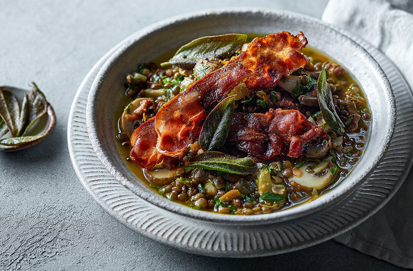 Green lentil stew with bacon and sage