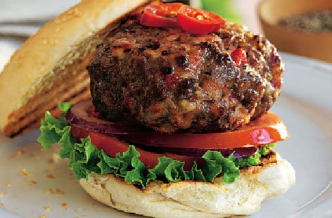 Image of "Beef burger with onions and jalapeños "
