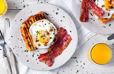 Image of "Jalapeño and cheese waffles with bacon and eggs "