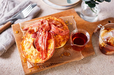 Image of "Cheesy French toast bagel with crispy bacon"