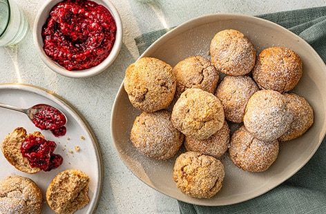 Image of "Rhiannon Lambert's baked almond doughnuts with berry dip"