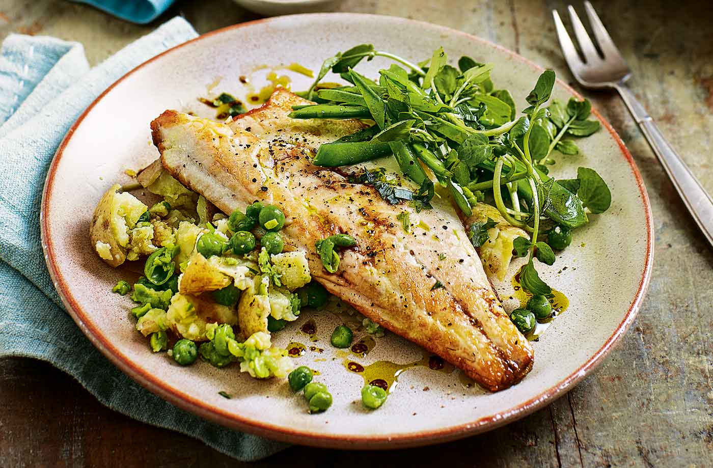 Pan-fried sea bass with pea and potato salad