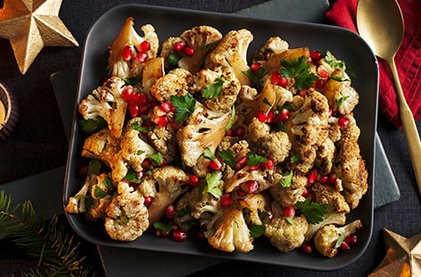 Image of "Roasted cauliflower with pomegranate and honey glaze"