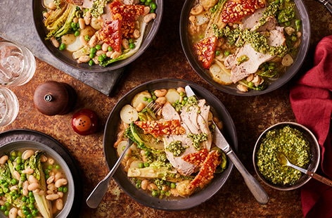 Image of "Roast pork with braised lettuce, cannellini beans, new potatoes and almond pesto"