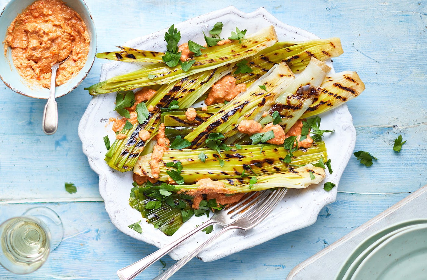 Charred leeks with romesco sauce