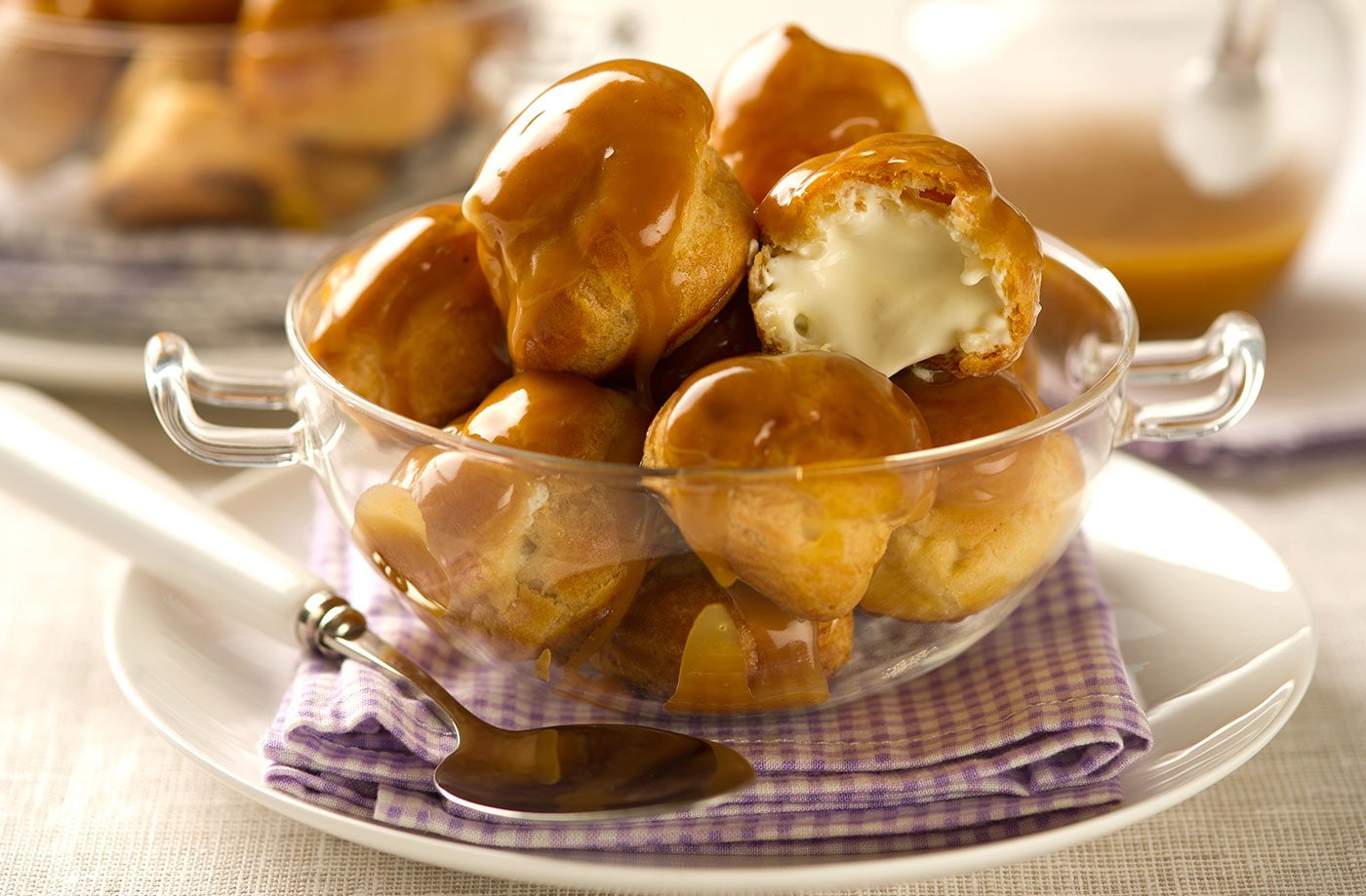 Profiteroles with cardamom crème fraîche and orange toffee sauce