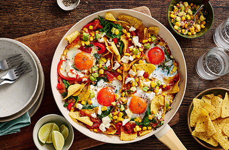Image of "Mexican-style baked eggs with tortilla chips"
