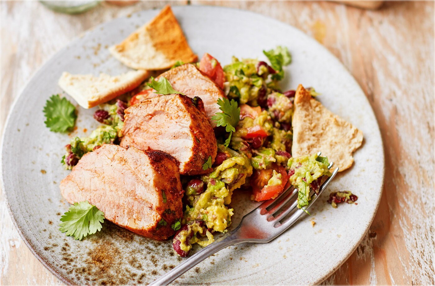 Spicy pork with chunky bean guacamole