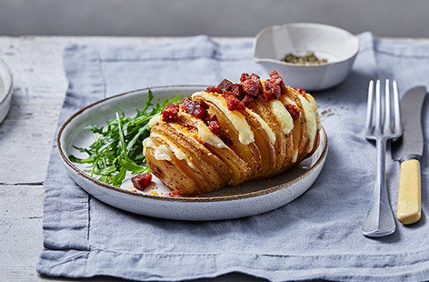 Image of "Giant cheesy hasselback potatoes"