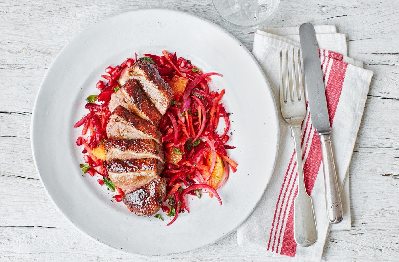 Spiced duck breasts with beetroot, orange and pomegranate slaw
