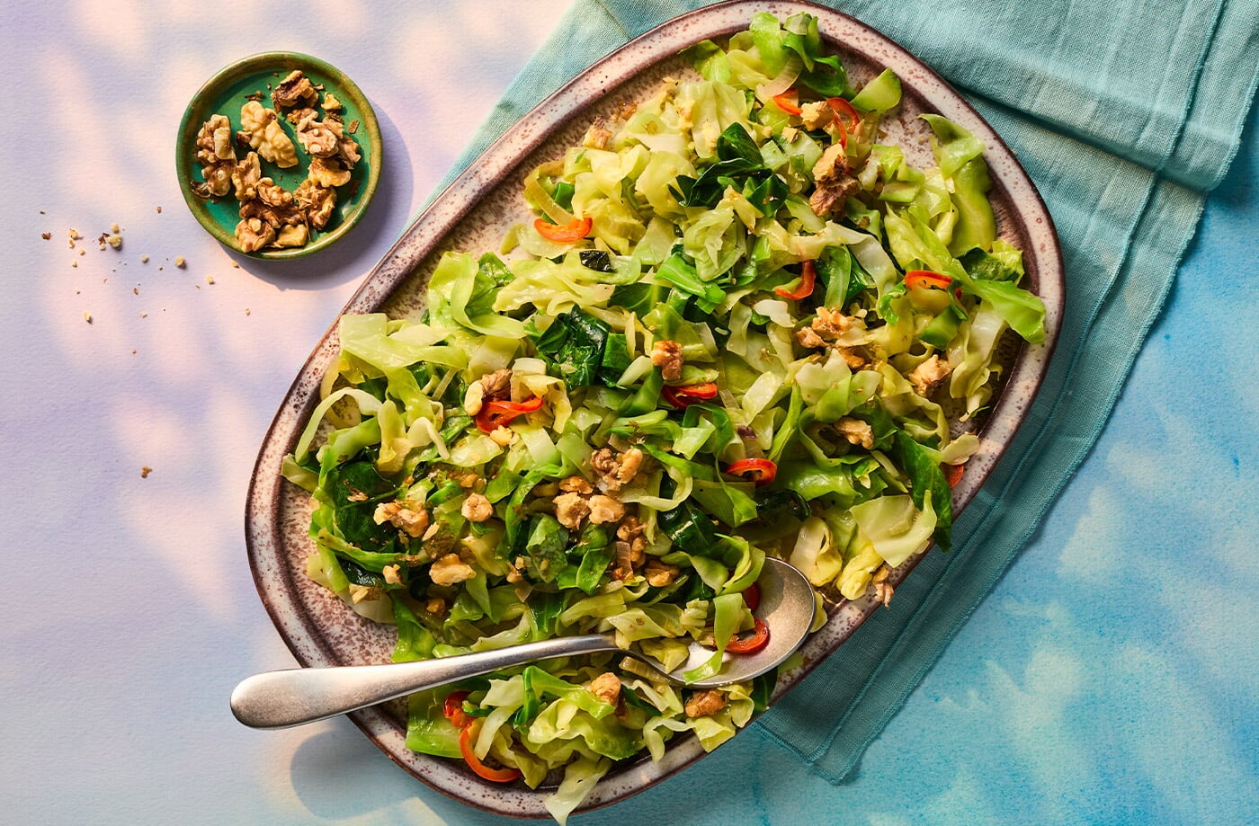 Shredded cabbage with shallots and walnuts