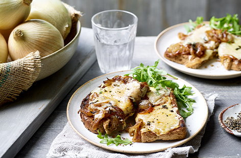 Image of "Sweet balsamic onions with melted Cheddar and herbs on toast"
