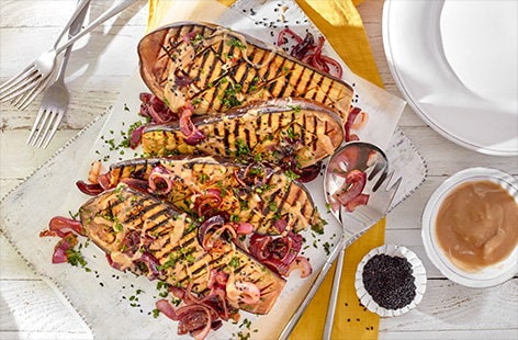 Image of "Whole blackened aubergine with caramelised onions"
