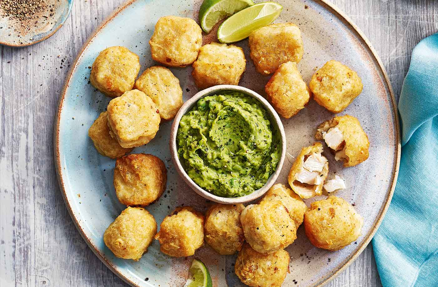 Fish nuggets with avocado and pea dip