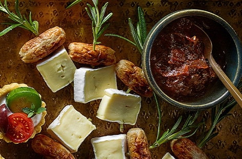 Image of "Brie and sausage rosemary sticks"