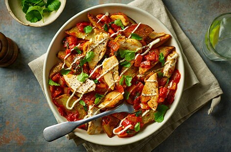 Image of "Harissa-spiced loaded potato wedges"