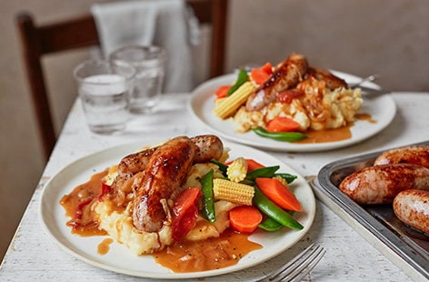 Image of "Sausage and cheesy mash with tomato gravy "