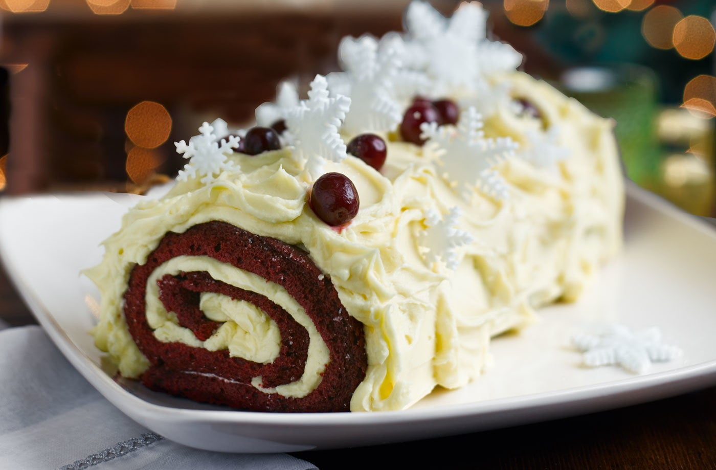 Red velvet bûche de Noël with boozy cranberries