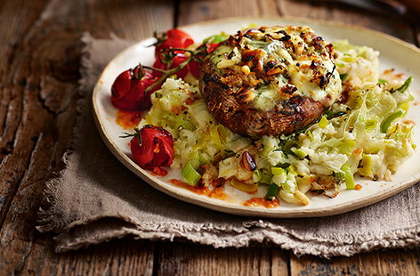 Image of "Cheesy stuffed mushrooms with leek mash"