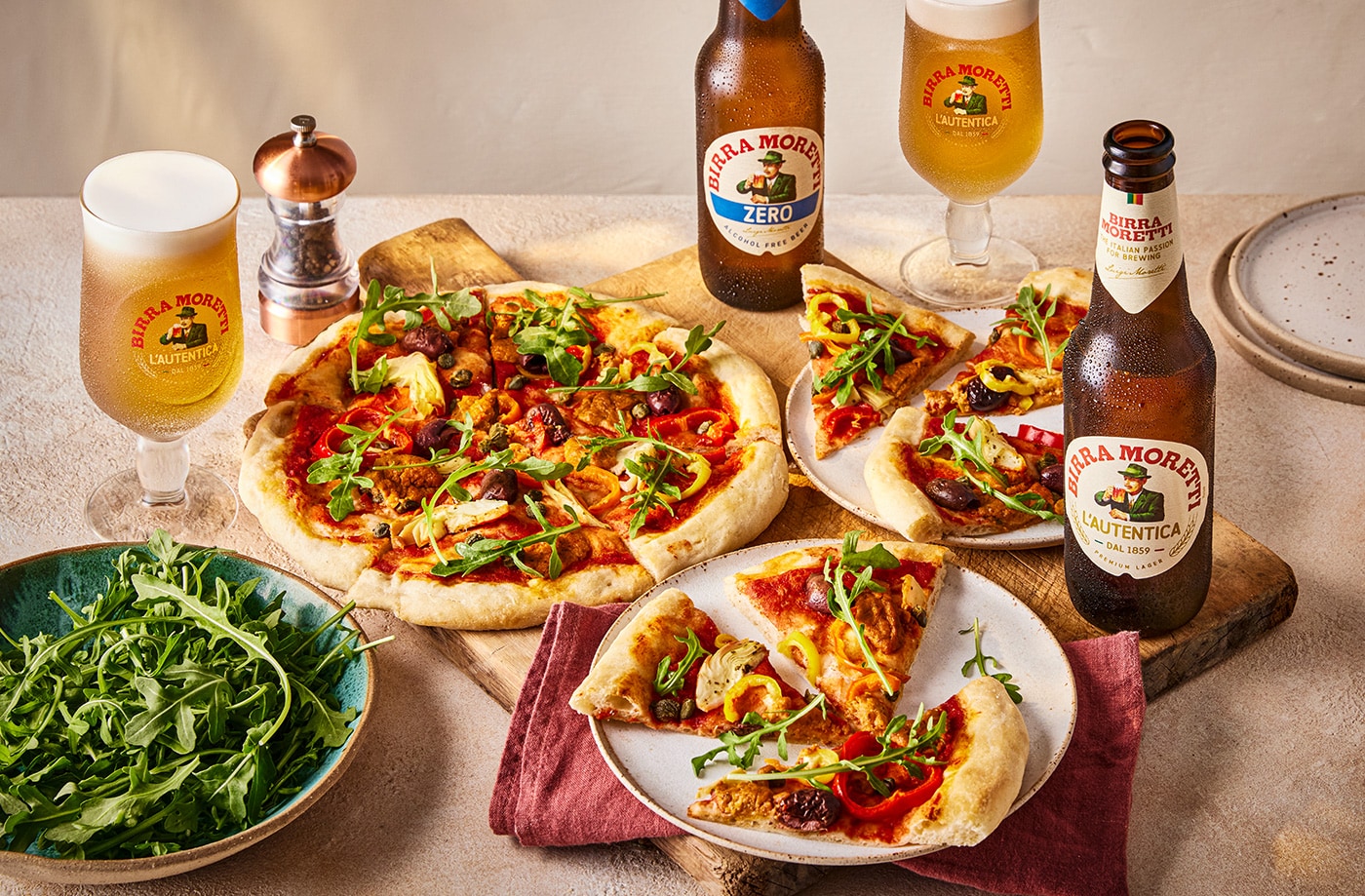 Vegan pizza with peppers, artichokes and olives