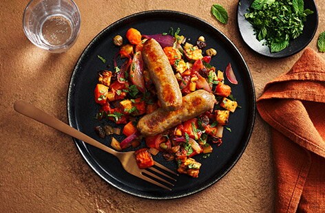 Image of "Sausages with Sicilian-inspired carrot stew"