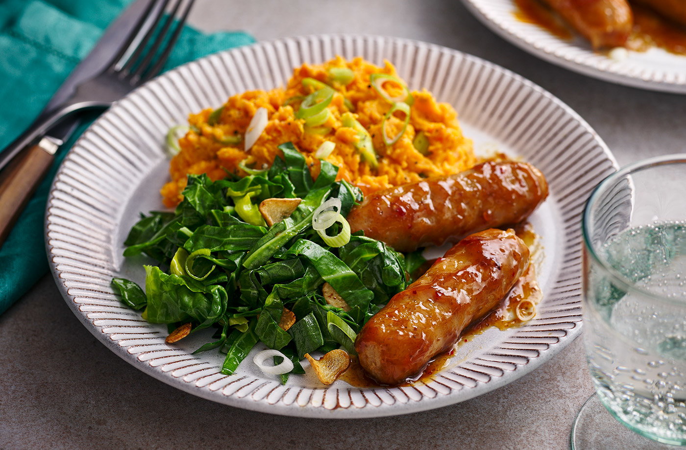Teriyaki-glazed sausages with sweet potato mash