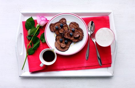 Image of "Chocolate mini teddy bear pancakes with berries and syrup"