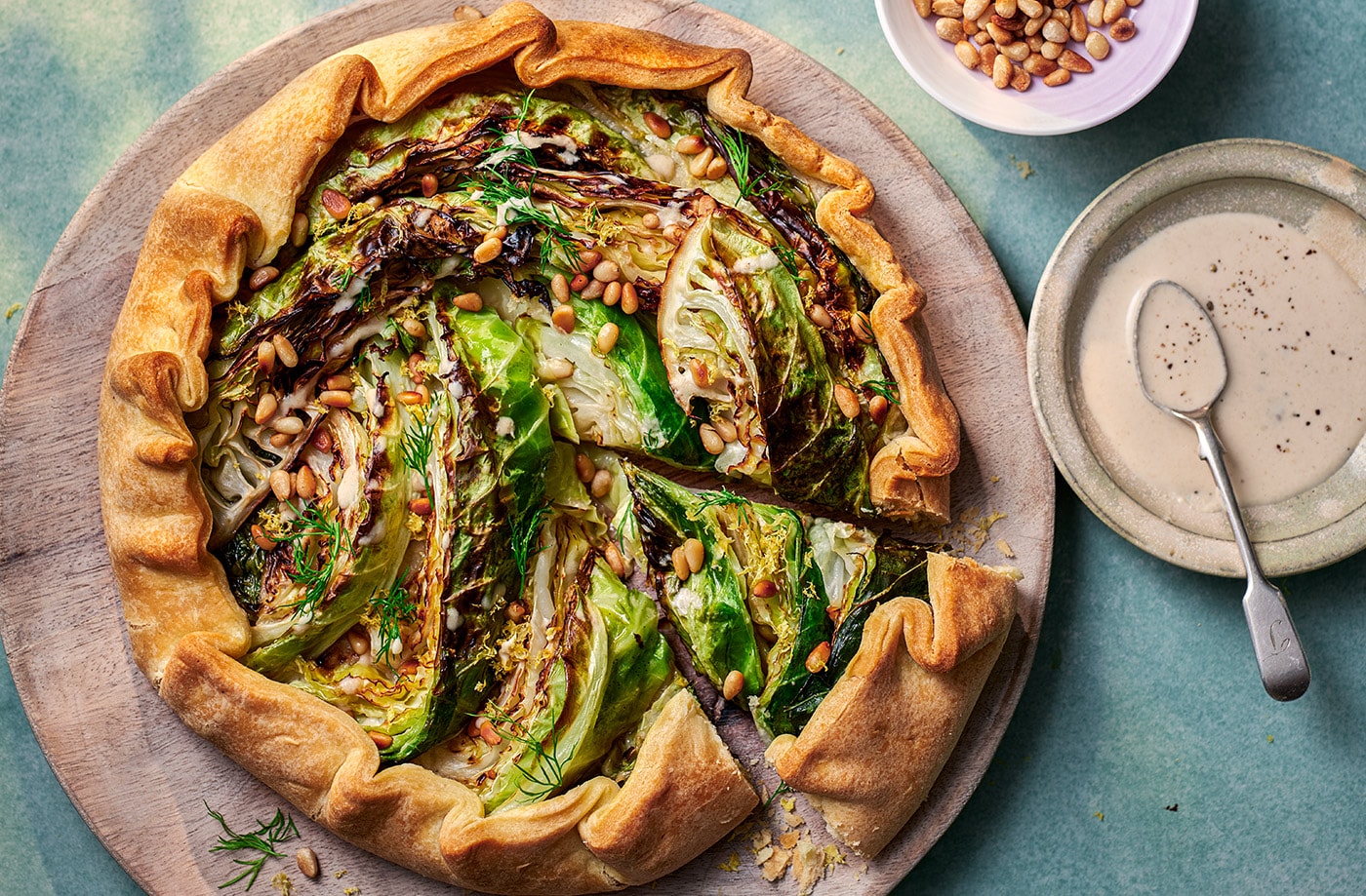 Charred cabbage galette with roasted garlic and tahini